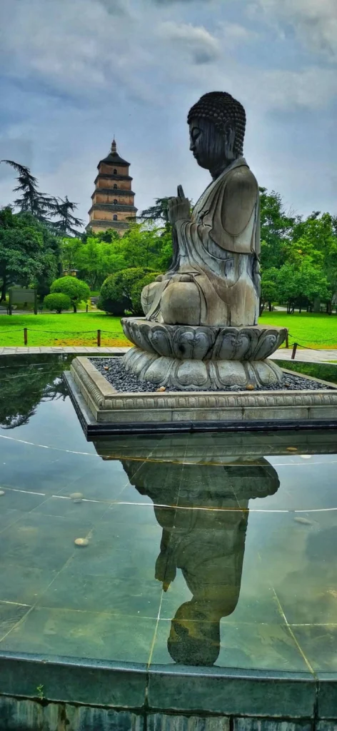 Buddha Statue and Big Wild Goose Pagoda in the Same Frame